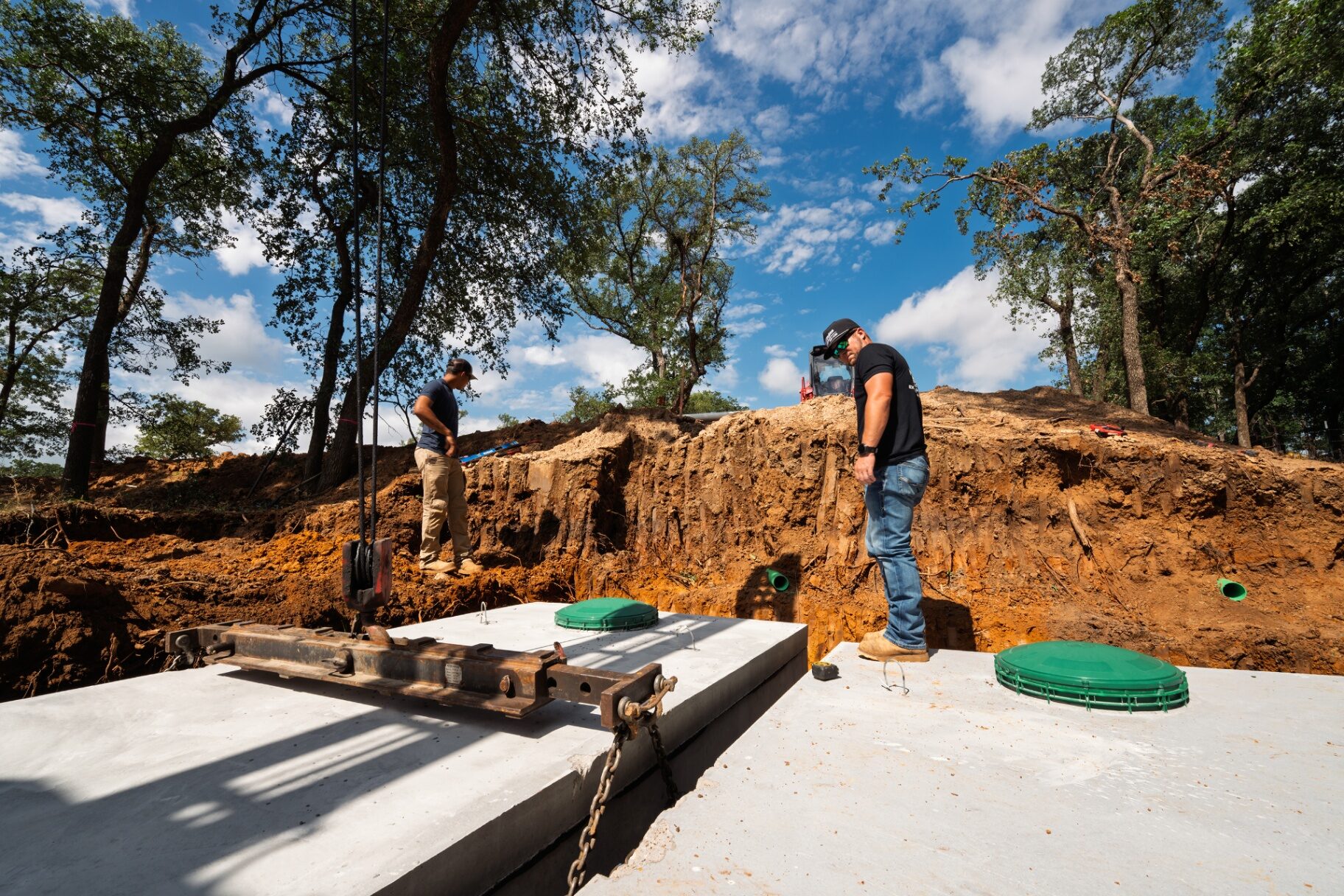 Concrete residential septic tank set in place at a Burleson, Texas home site
