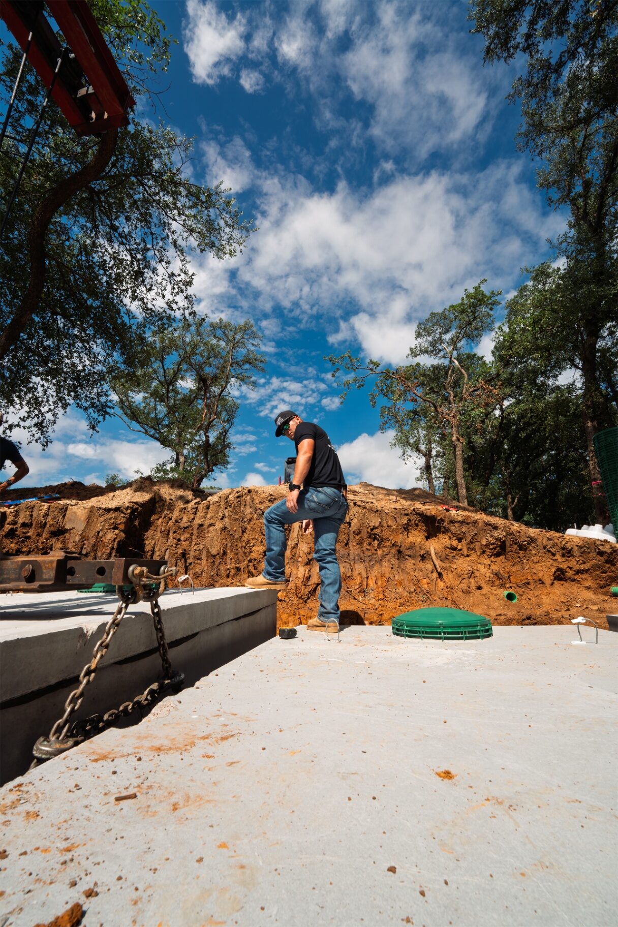 MillerPro installer on a freshly set septic tank